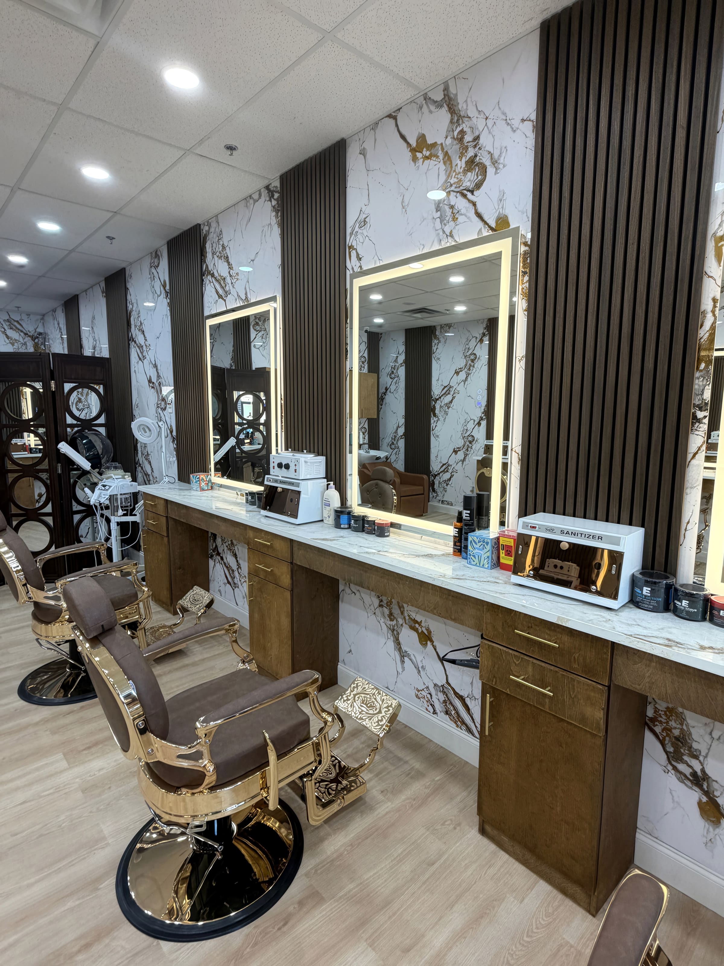 Fade & Style Barber Shop in Allen, Texas with marble-look station walls, gold framed mirrors, and leather barber chairs